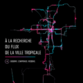 Une vue pittoresque d'une ville tropicale, avec des palmiers et des bâtiments colorés.